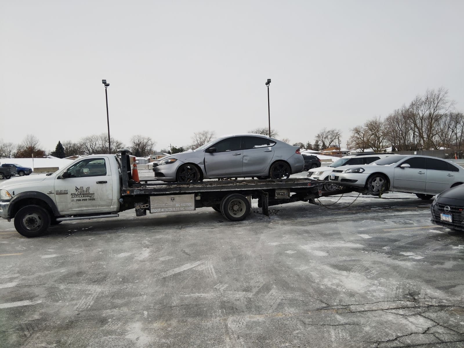 A-1 Towing emergency tow truck with Dodge Dart in Chicago